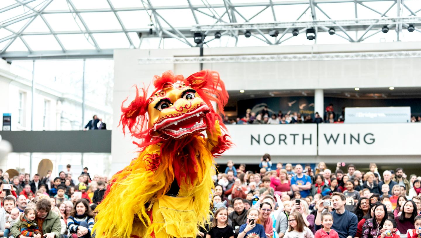A lion dance taking place at the National Maritime Museum during Chinese New Year