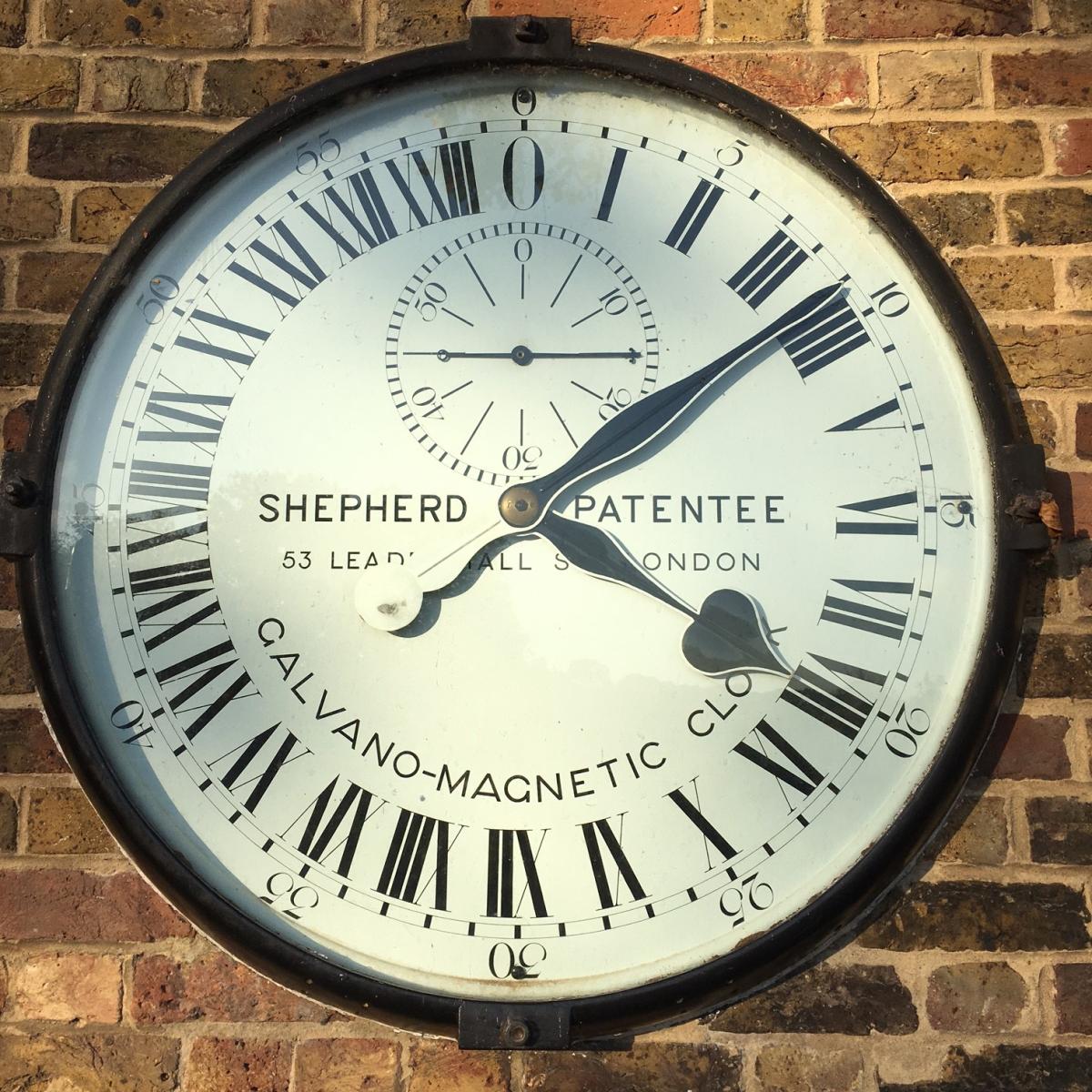 A clock with 24 hours displayed on the face, installed outside the Royal Observatory Greenwich