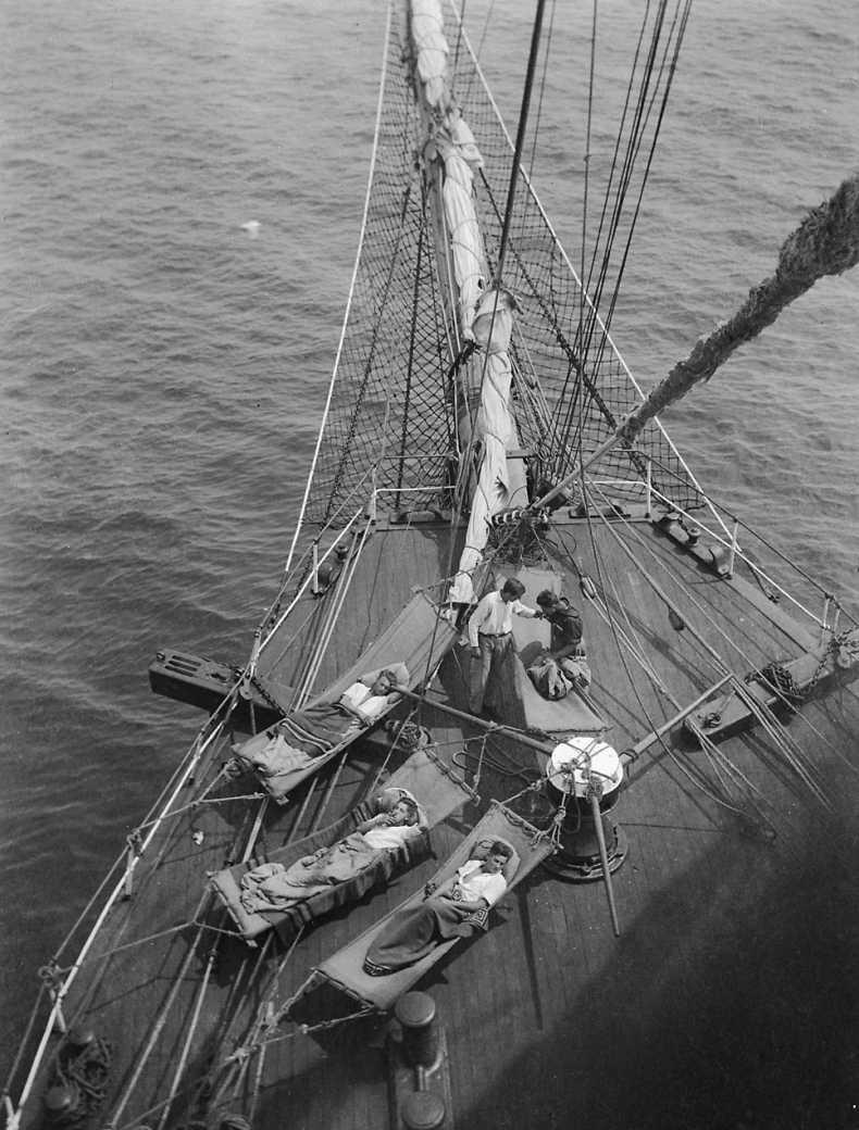 Crew relaxing in hammocks on the Parma in 1902