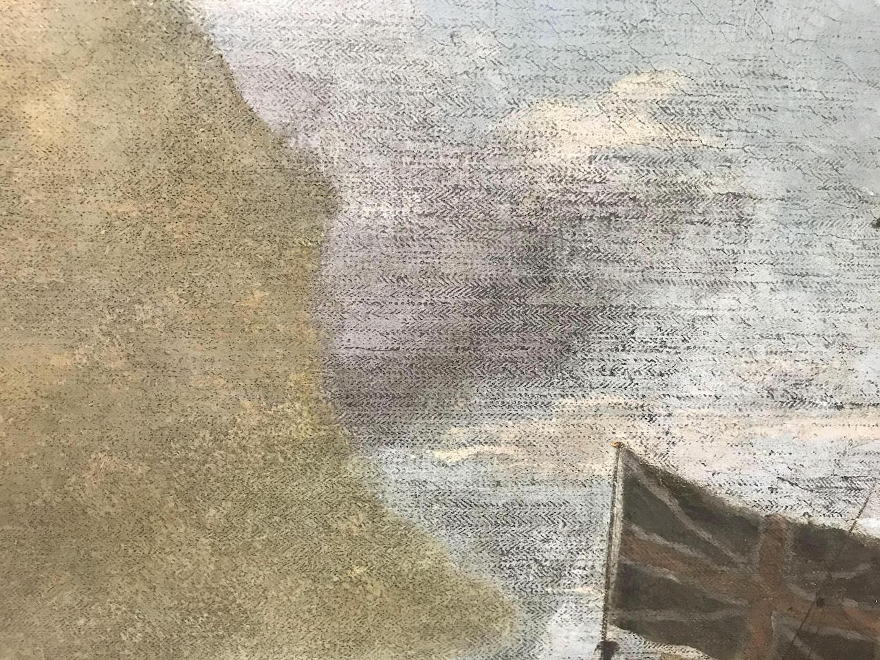 Close up view of a painting during conservation, with a yellowish layer of 'overpaint' on the left and a brighter cloudy view on the right after the overpaint is removed