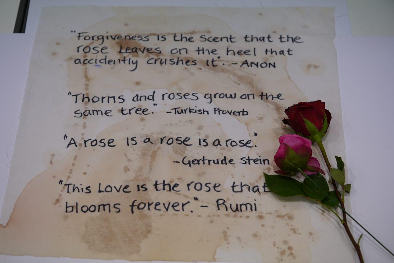 calico with writing quotes about roses