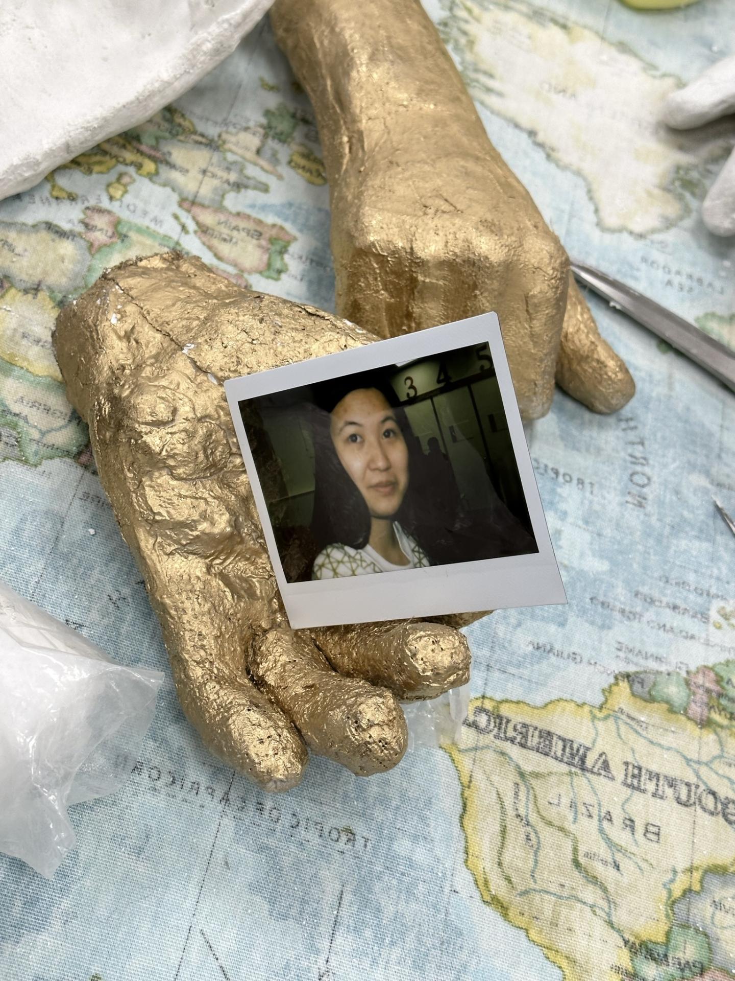 hand holding a polaroid