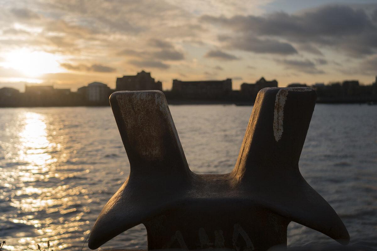 Image of old piece of boating equipment next to the Thames at sunset