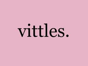 Logo which is a pink square with the word Vittles written in black times new roman font 