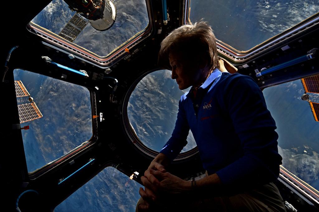 NASA Astronaut Peggy Whitson aboard ISS above Earth. Image credit: NASA