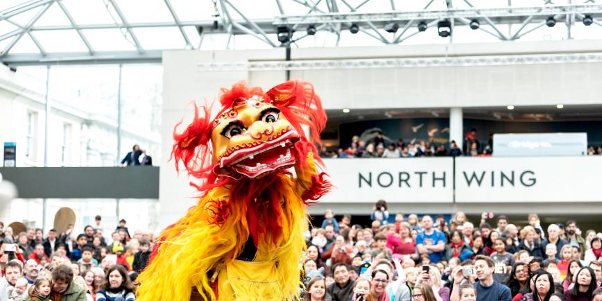 A lion dance taking place at the National Maritime Museum during Chinese New Year