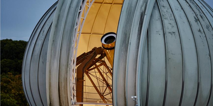 The Great Equatorial Telescope at the Royal Observatory at twilight, with the onion-shaped dome partially open
