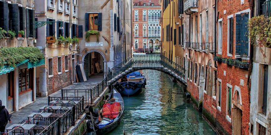 Image of Venetian houses and canal with gondolas