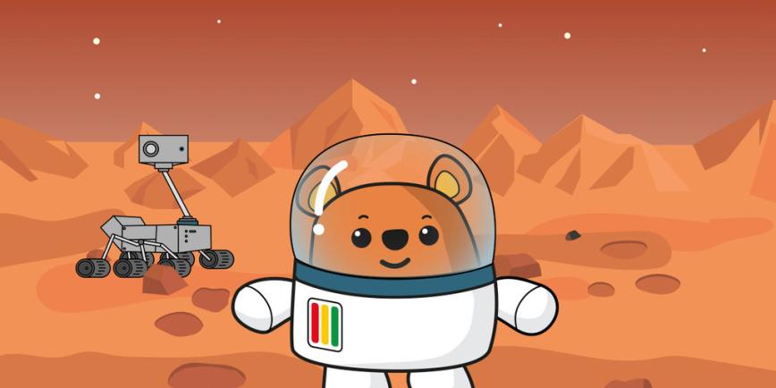 Ted the bear is stood on Mars, with a Martian rover behind him.