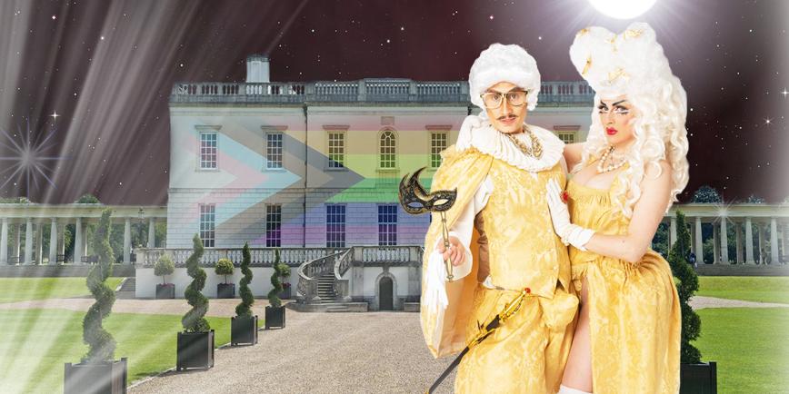 An image of drag King, Adam All, and Drag Queen, Apple Derrieres, standing in front of a night time landscape of the Queen's House that has the progress Pride Flag projected onto it. Adam and Apple wear golden royal-inspired matching outfits and white wigs. 