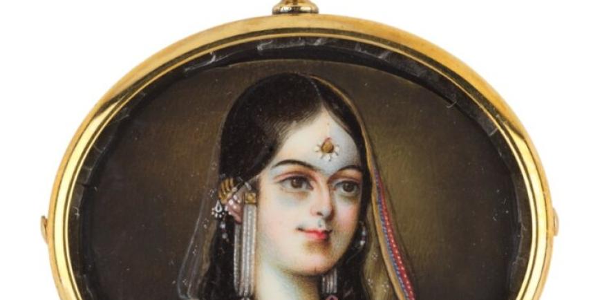 a cameo with a painting of a Indian Queen with gold surround