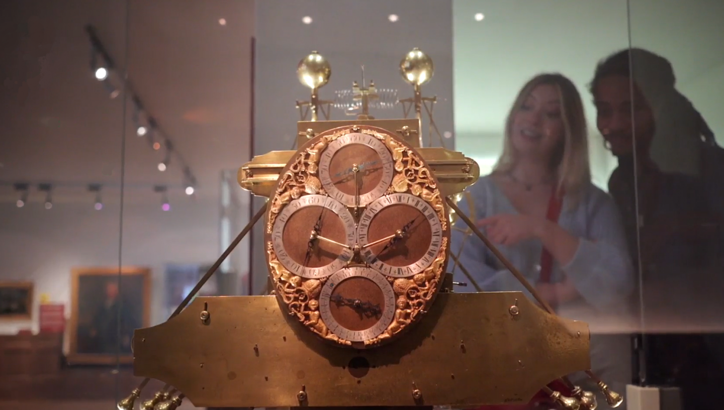 Man and woman looking at Harrison's clocks