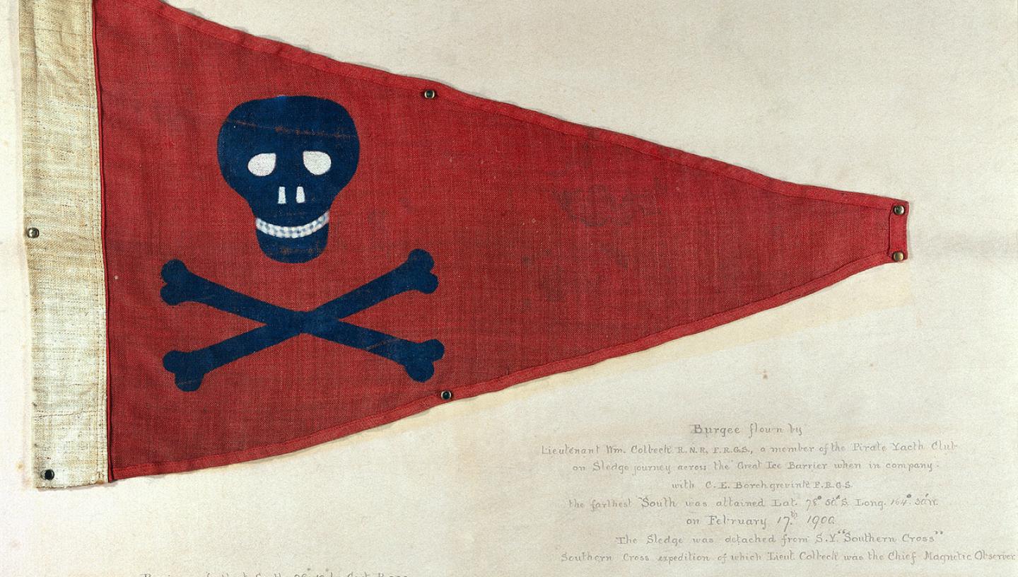 A red triangular flag with a black skull and crossbones