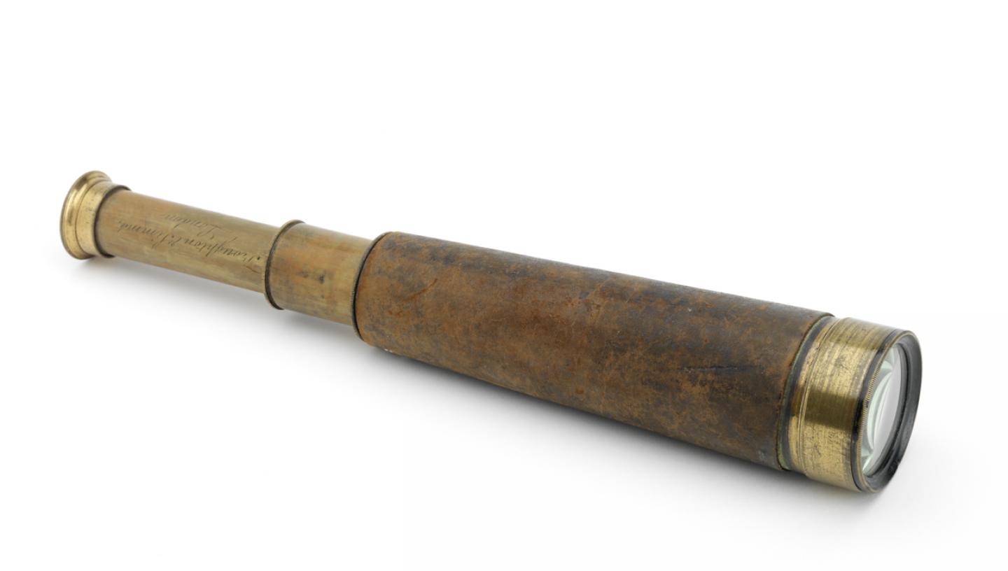 A brown and gold telescope