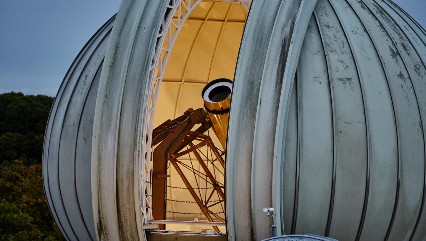 The Great Equatorial Telescope at the Royal Observatory at twilight, with the onion-shaped dome partially open