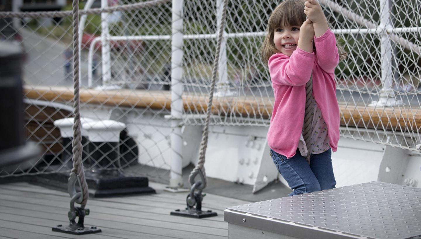 A child plays on deck on Cutty Sark