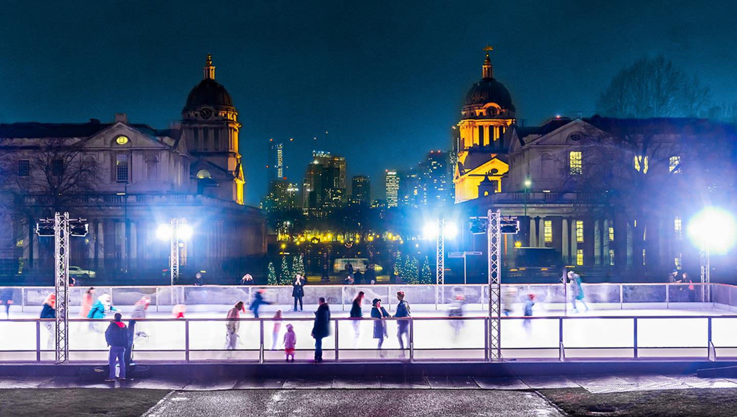 A landscape view of the Queen's House Ice Rink in Greenwich at night