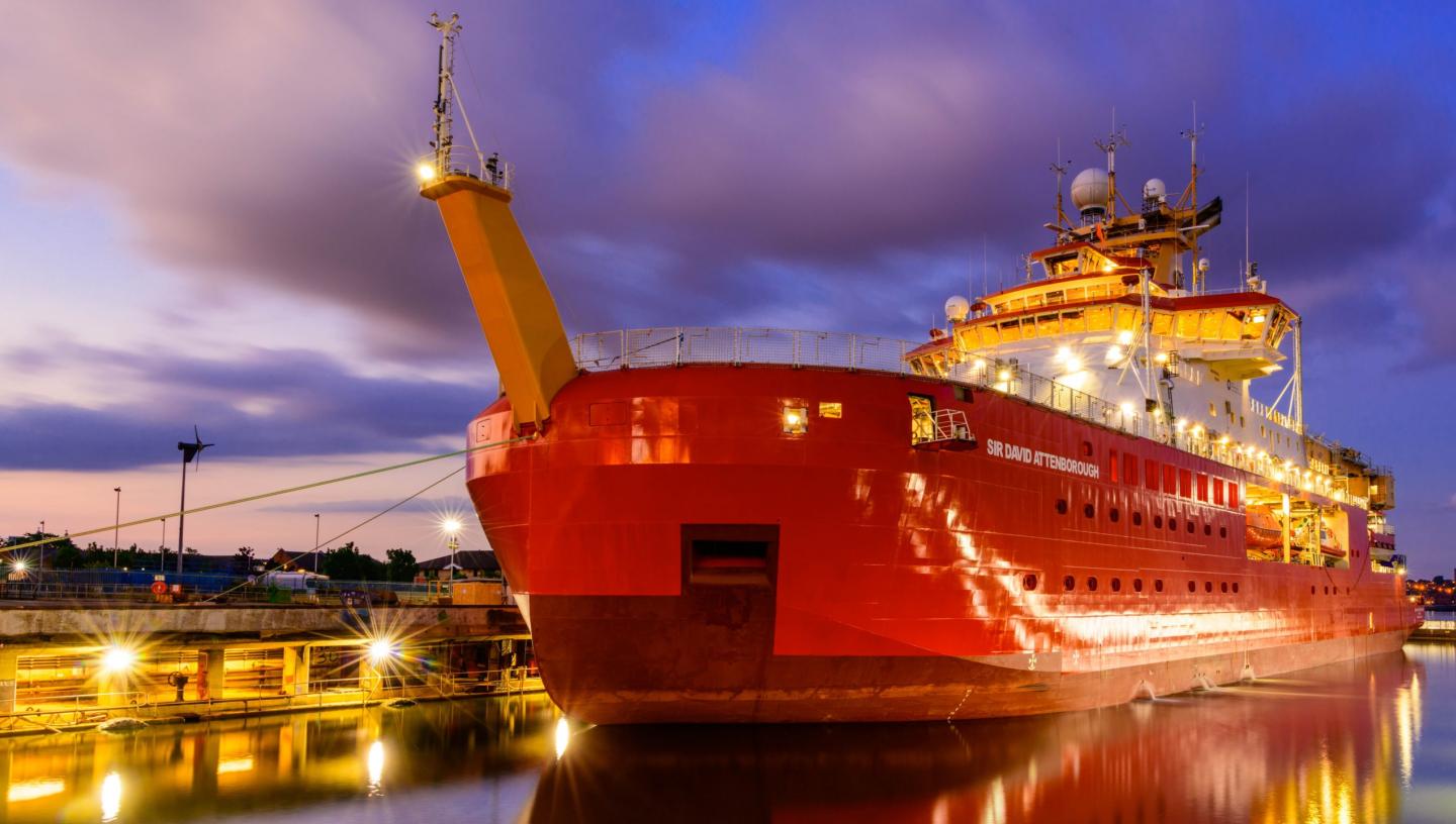 The UK polar research ship Sir David Attenborough lit up at night at the Cammell Laird shipyard