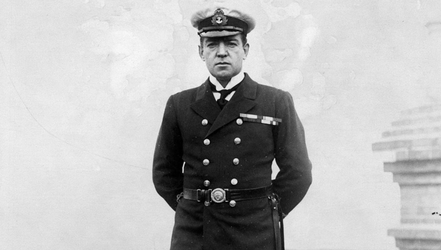 A black and white photograph of Sir Ernest Shackleton in Navy uniform