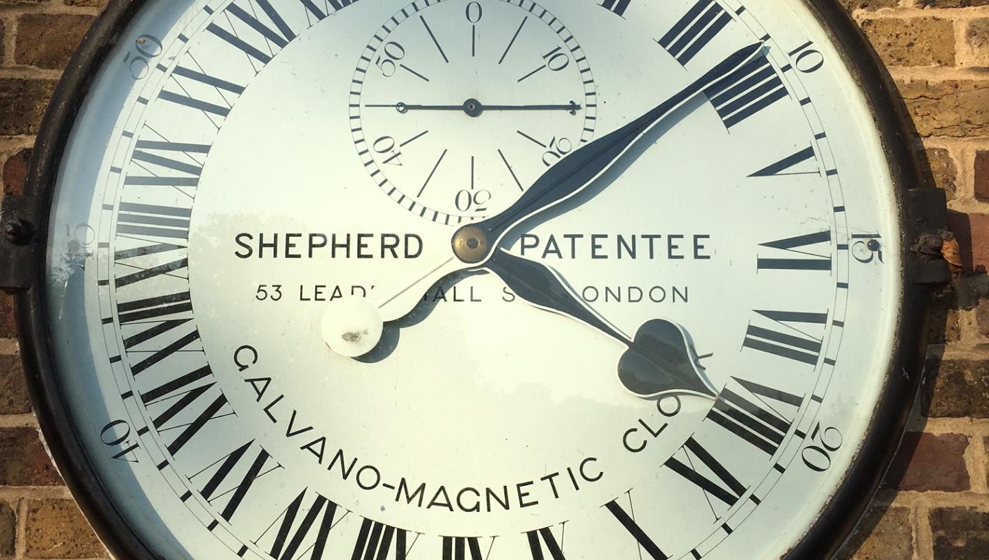 A clock with 24 hours displayed on the face, installed outside the Royal Observatory Greenwich
