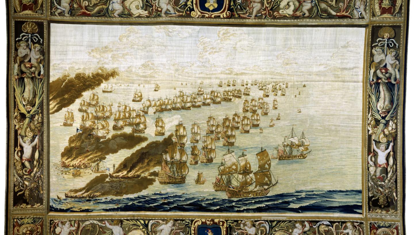 A large tapestry that depicts a naval battle and ships burning at sea
