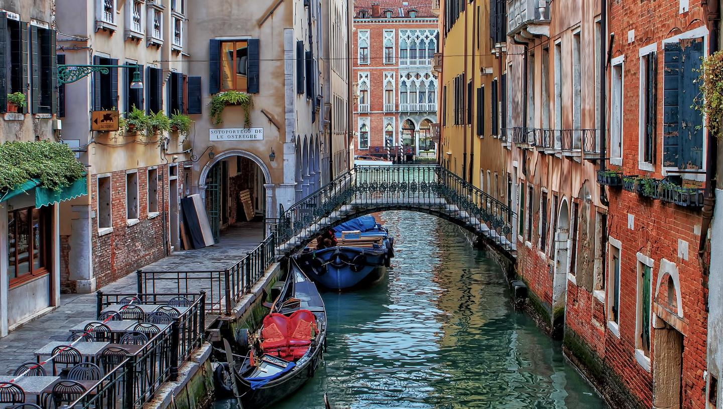 Image of Venetian houses and canal with gondolas