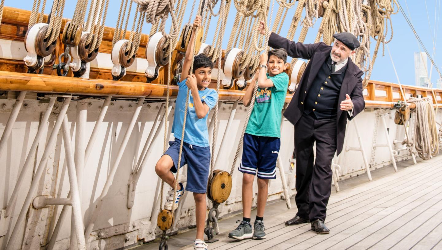 Captain Woodget and kids with ropes