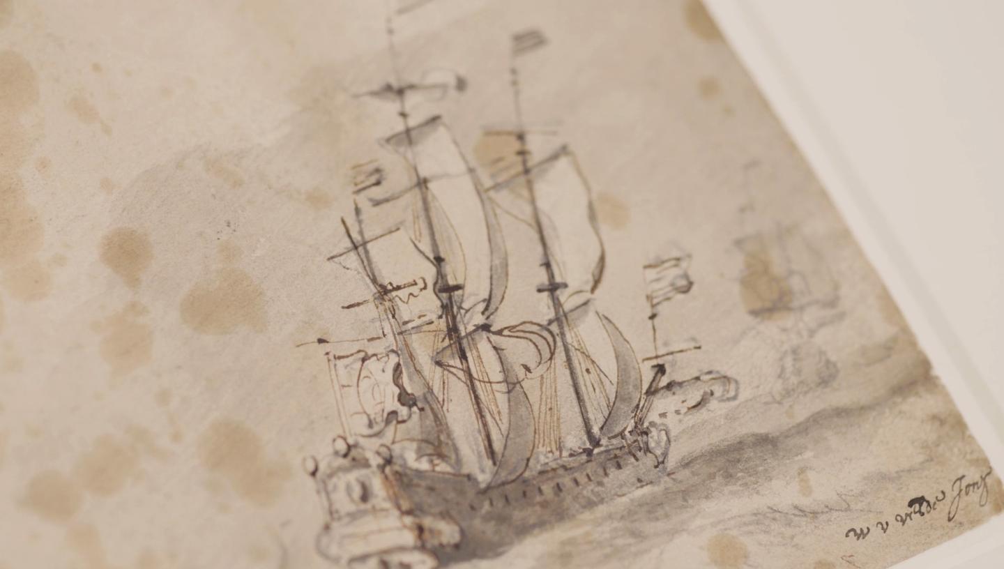 A close-up view of a drawing of a tall ship at sea. The fine lines of the masts and sails contrast with the sepia tone of the paper, which shows signs of age and staining