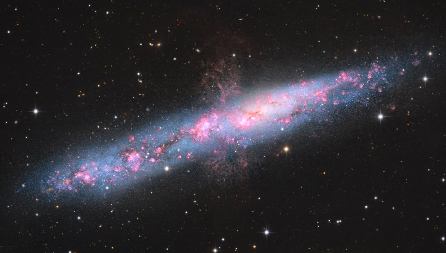 Side on image of a red spiral galaxy