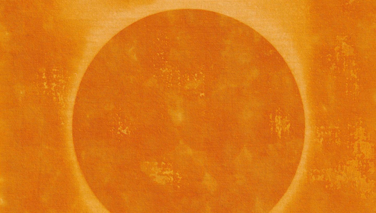 Solar printed image of the Sun, against an orange background the Sun appears as a yellow ring with flares coming off of it