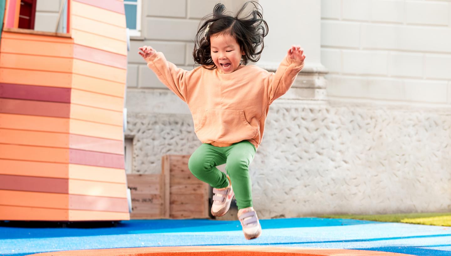 A girl jumps on a mini trampoline in the National Maritime Museum's outdoor playground