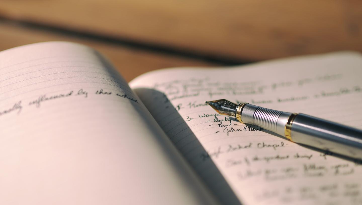 Written journal and pen