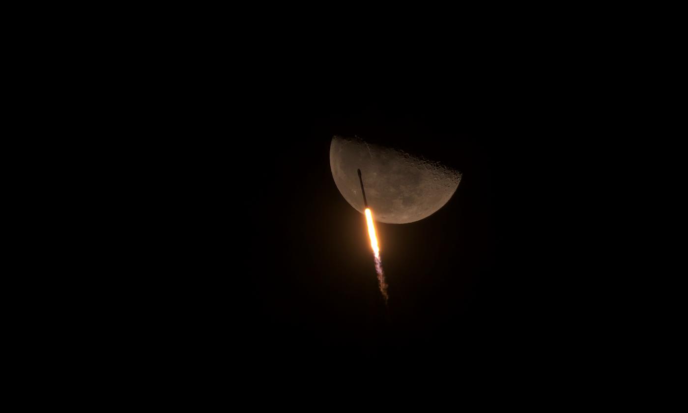 An image showing 'Falcon 9 soars past the Moon'