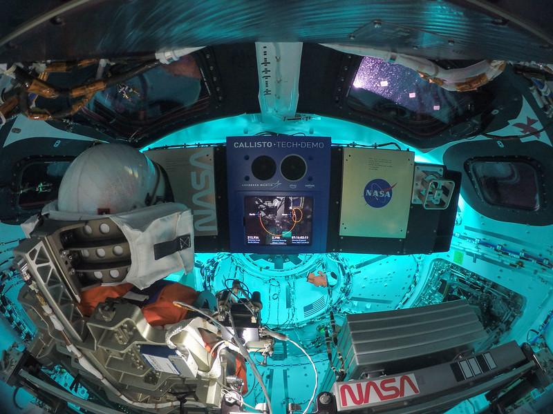 An image showing 'The interior of the Orion capsule. A Moonikin is visible on the left wearing the spacesuit the real astronauts will wear on later Artemis missions. '