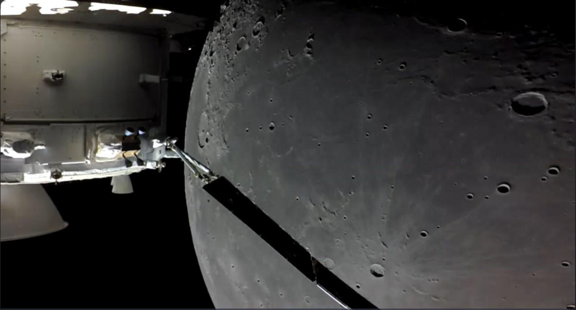 An image showing 'The Orion capsule making a close lunar flyby on its return journey, coming within around 128 km of the lunar surface | Credits: NASA'