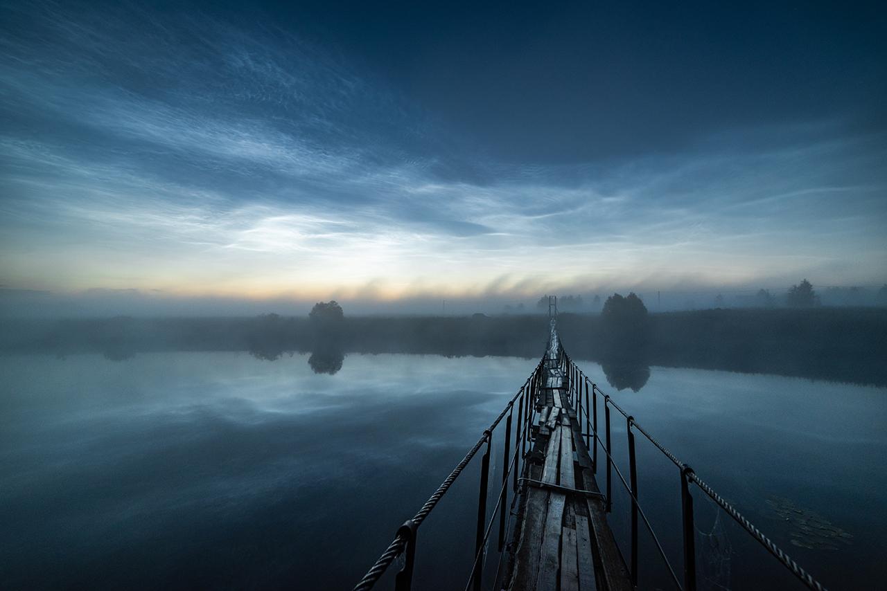 An image showing 'Beyond the Fog by Michael Zav'yalov, Astronomy Photographer of the Year 2020'
