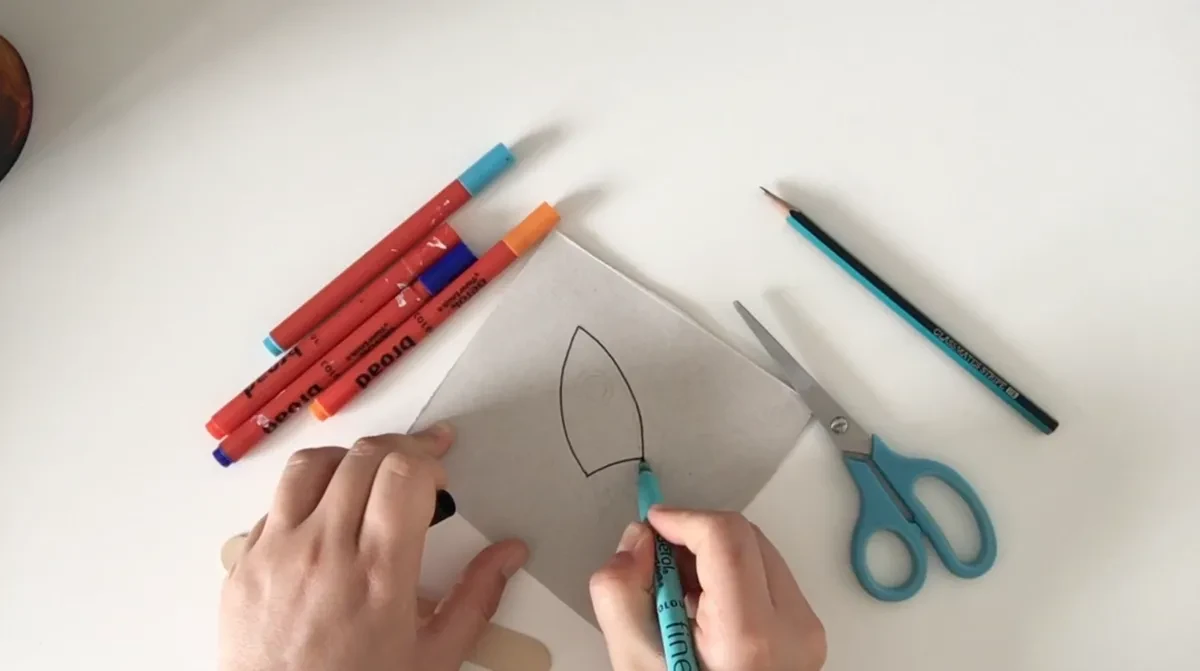 Drawing a rocket on cardboard