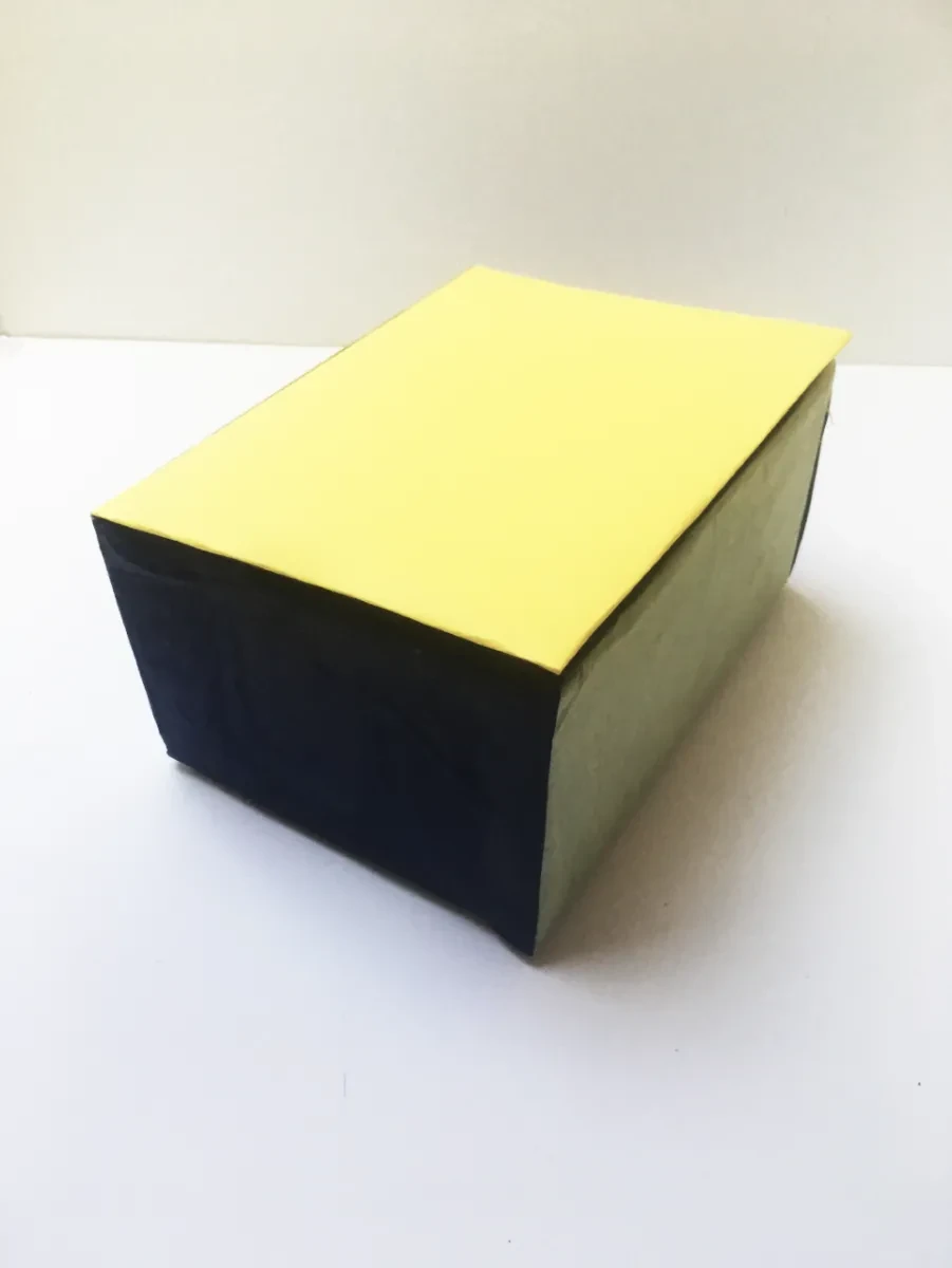 A cardboard box with a yellow cover