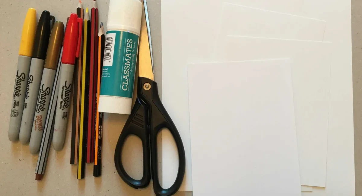 Coloured pens, pencils, glue, scissors and paper.