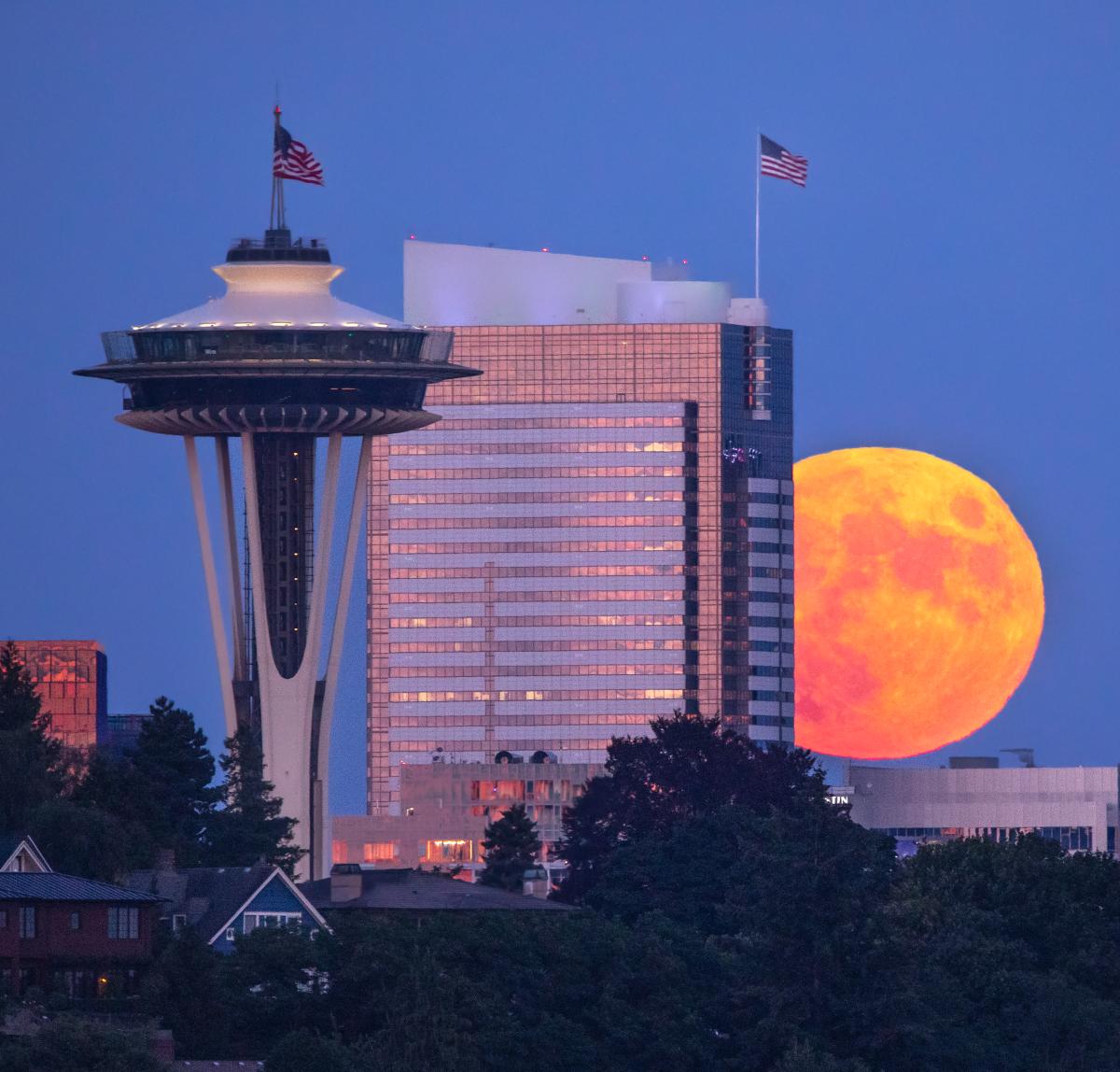 Orange full moon rising in Seattle, USA