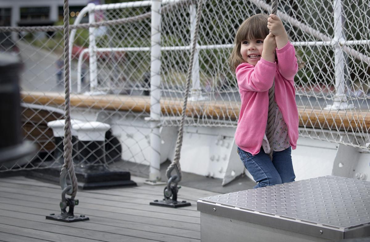 A child plays on deck on Cutty Sark