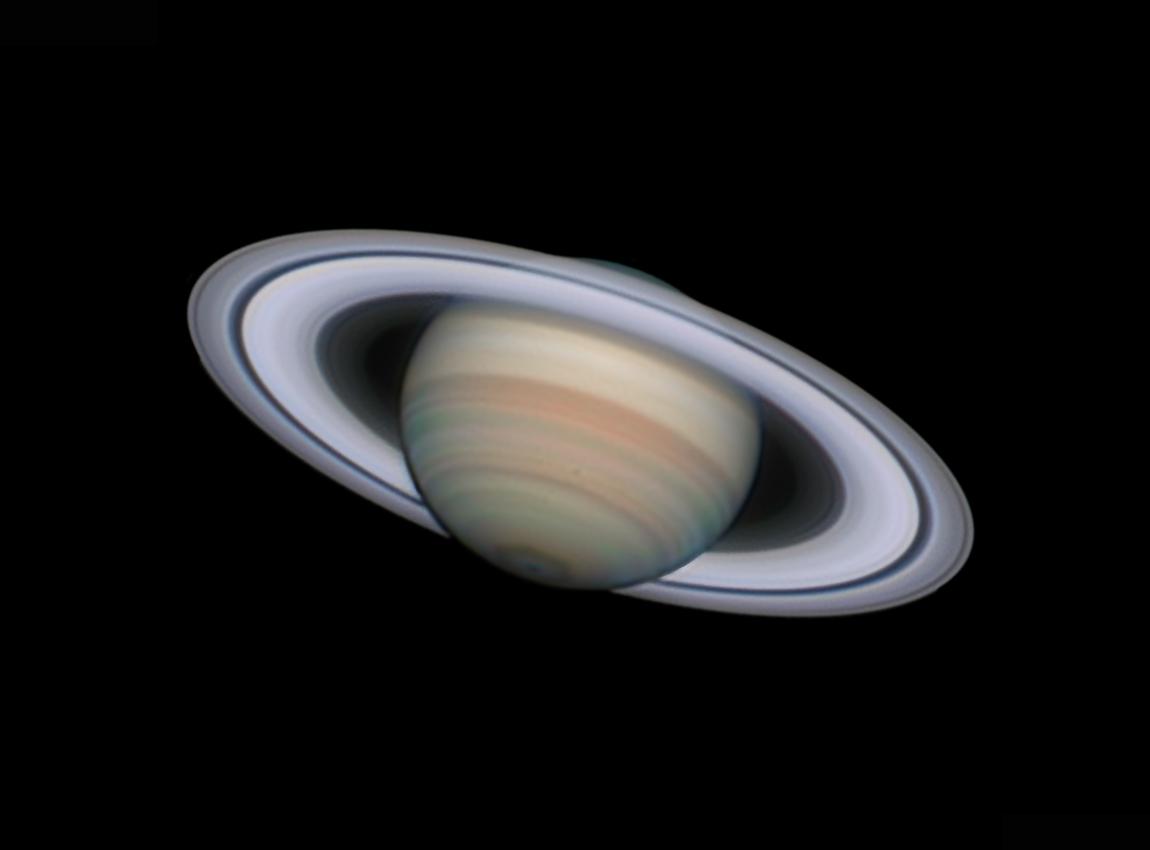 The planet Saturn photographed using a telescope