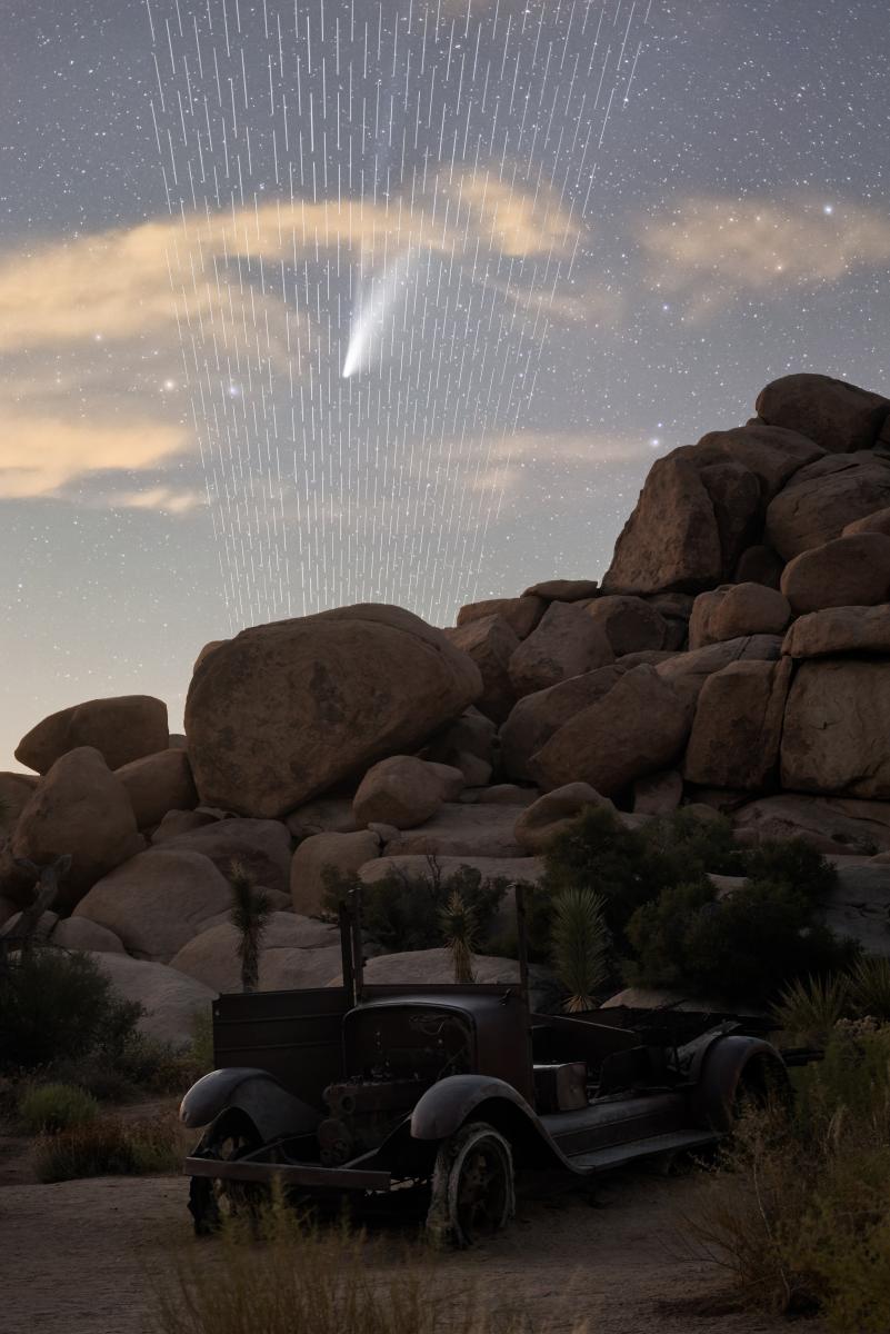 An abandoned car amongst rocks in California. Comet Neowise shoots down from above 