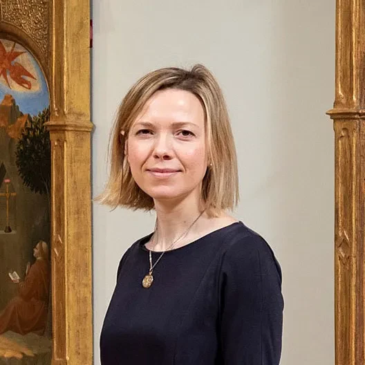 woman standing in a museum