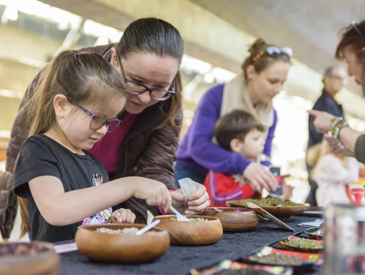Families taking part in a tea making workshop