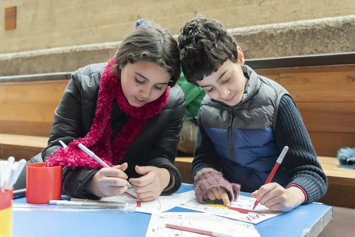 Boy and girl drawing in a workshop at Cutty Sark
