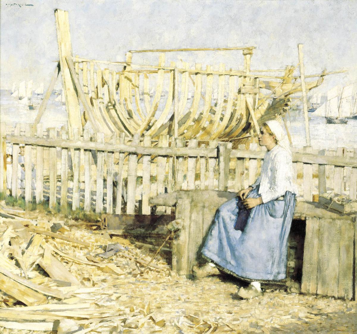 A young girl sits beside a fishing boat under construction