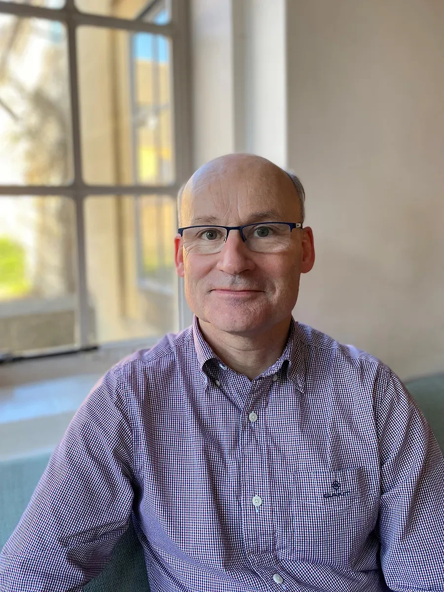 A portrait photograph of Professor Andrew Thompson