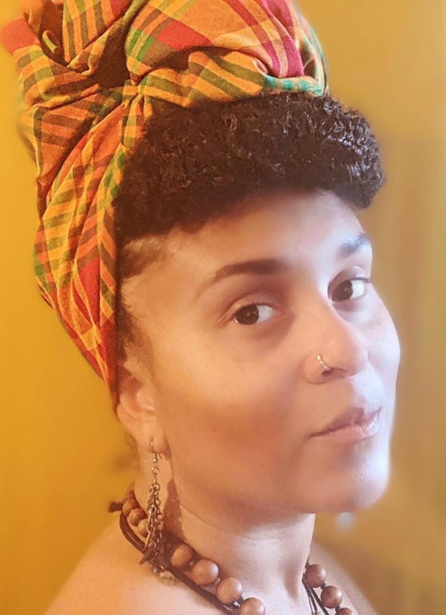 head and shoulders of a woman wearing a head wrap