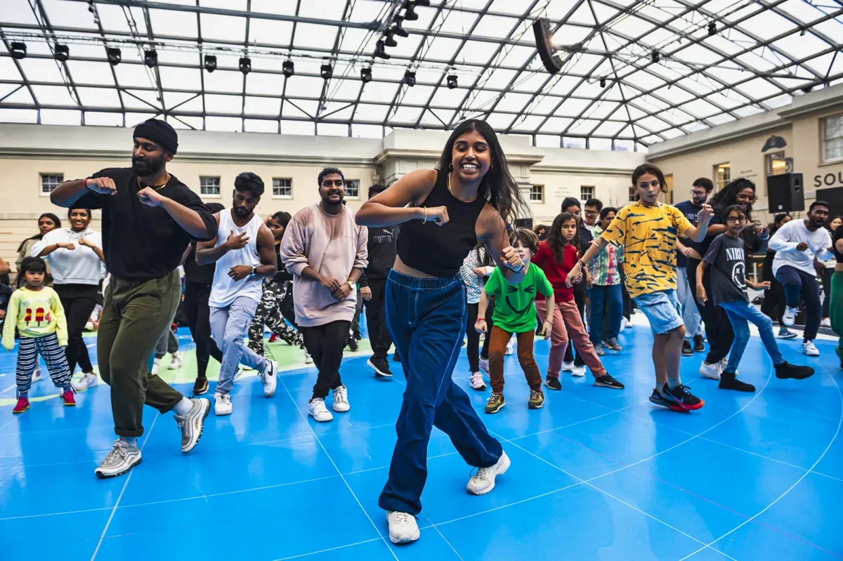 A group of dancers perform on the Great Map of the National Maritime Museum